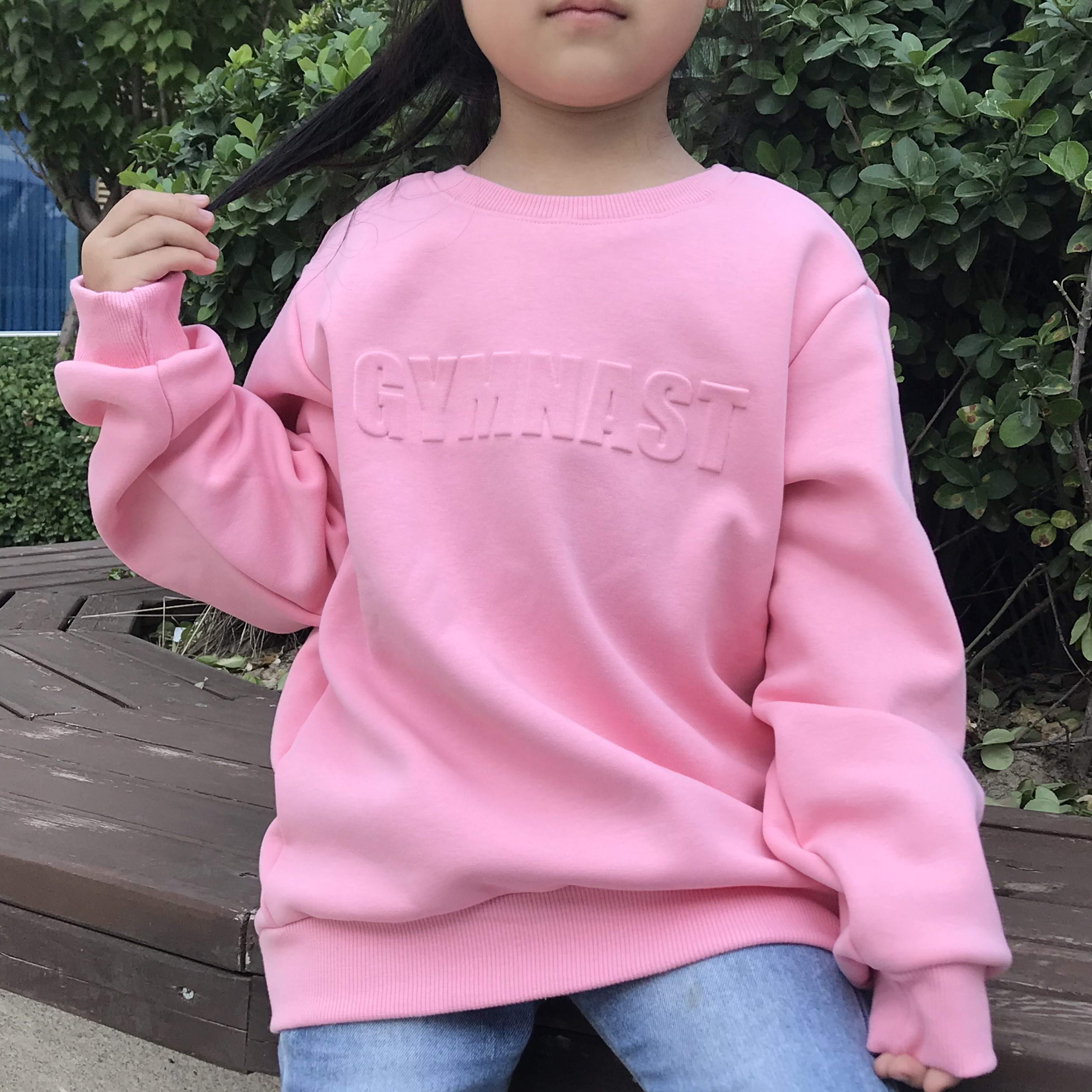 pink gymnast sweatshirt
